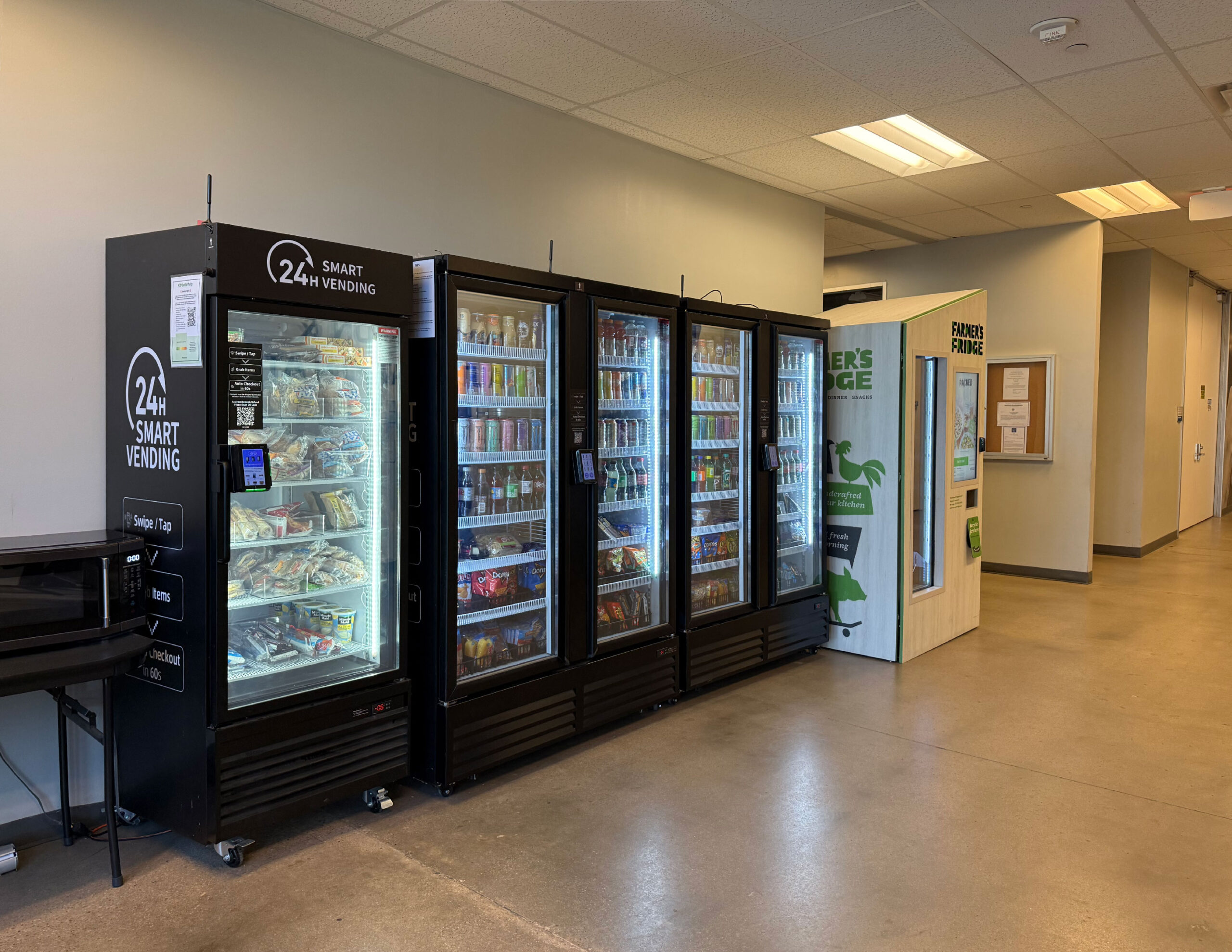 Multiple HAHA smart vending machines lined up in a break room
